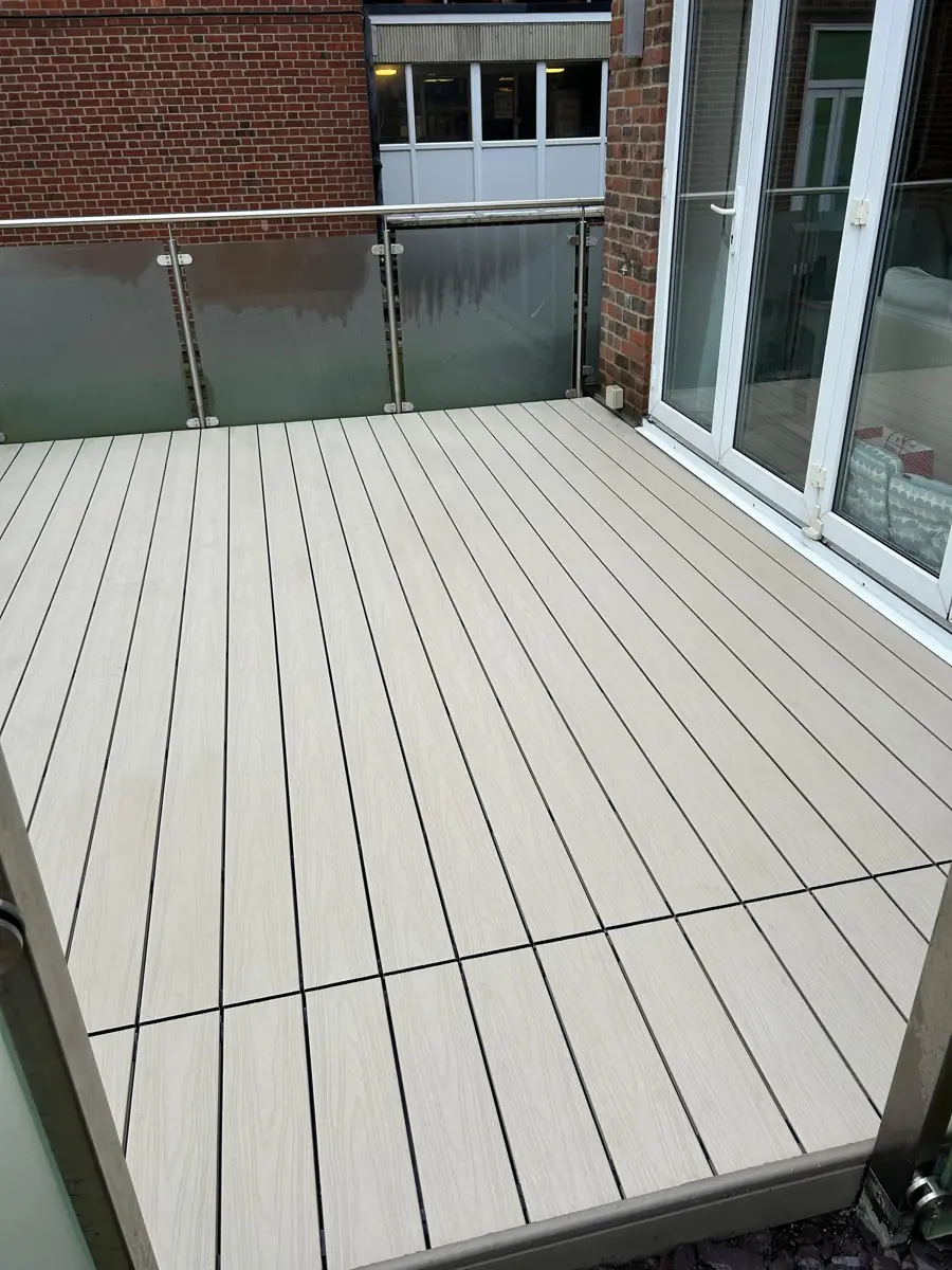 The finished Whetstone terrace: light composite boards inside the glass balustrade